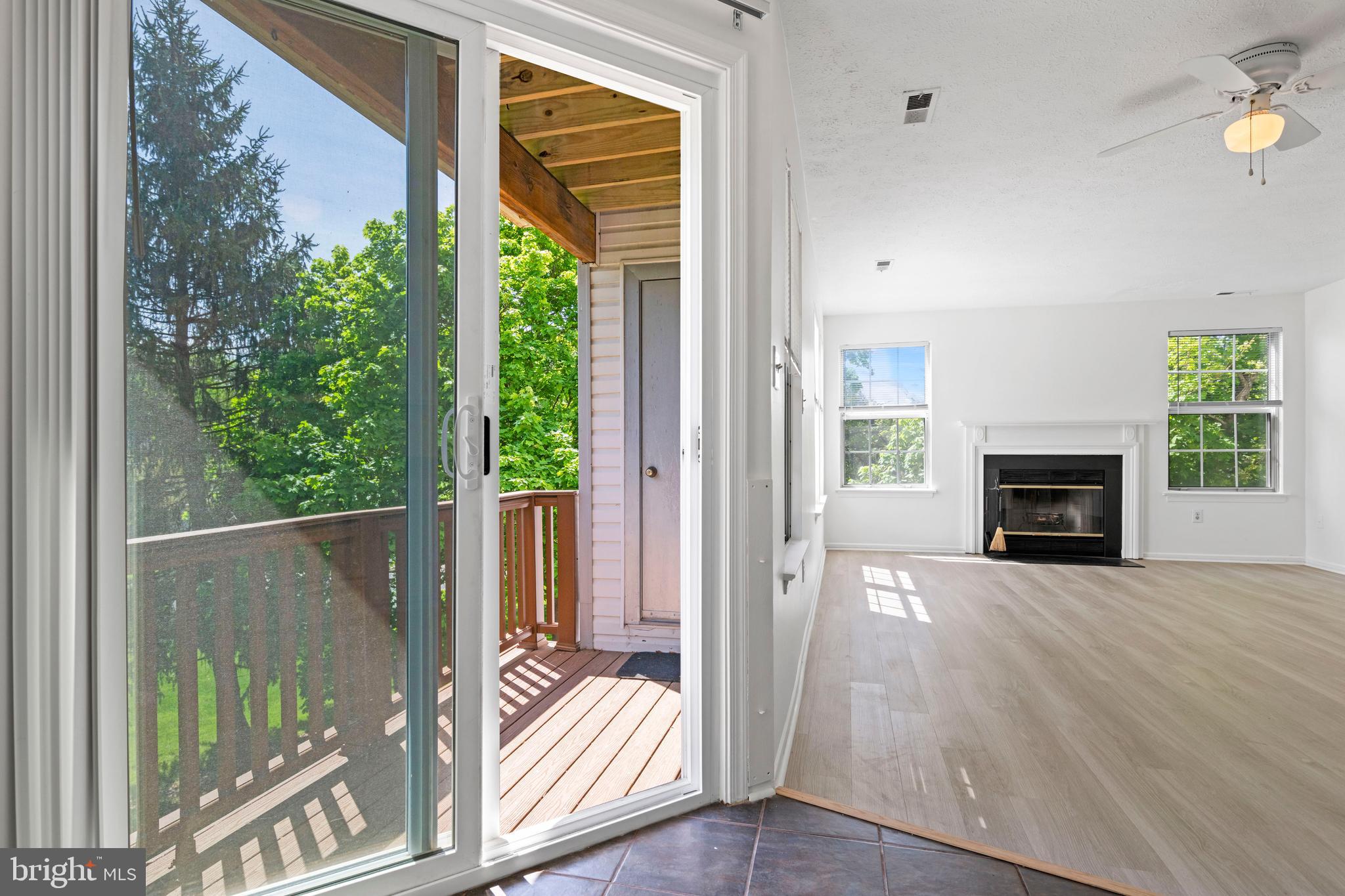 31 Beagle Run, Unit 88 Nottingham, MD 21236 - Photo 20 of 43 a view of an empty room with a fireplace and a floor to ceiling window