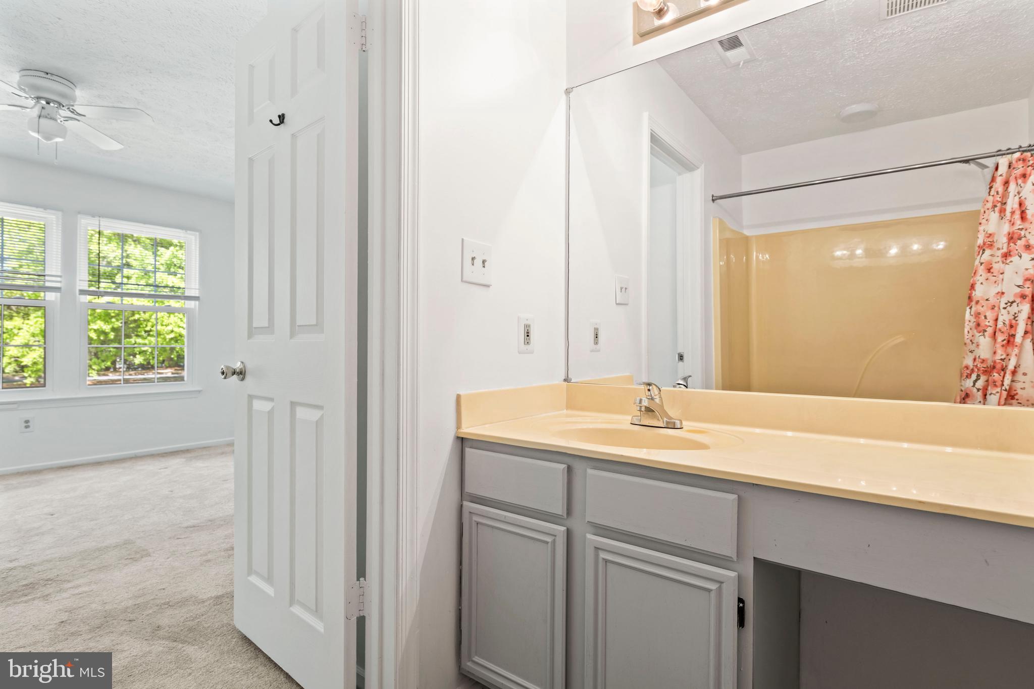 31 Beagle Run, Unit 88 Nottingham, MD 21236 - Photo 30 of 43 a bathroom with a sink and a mirror