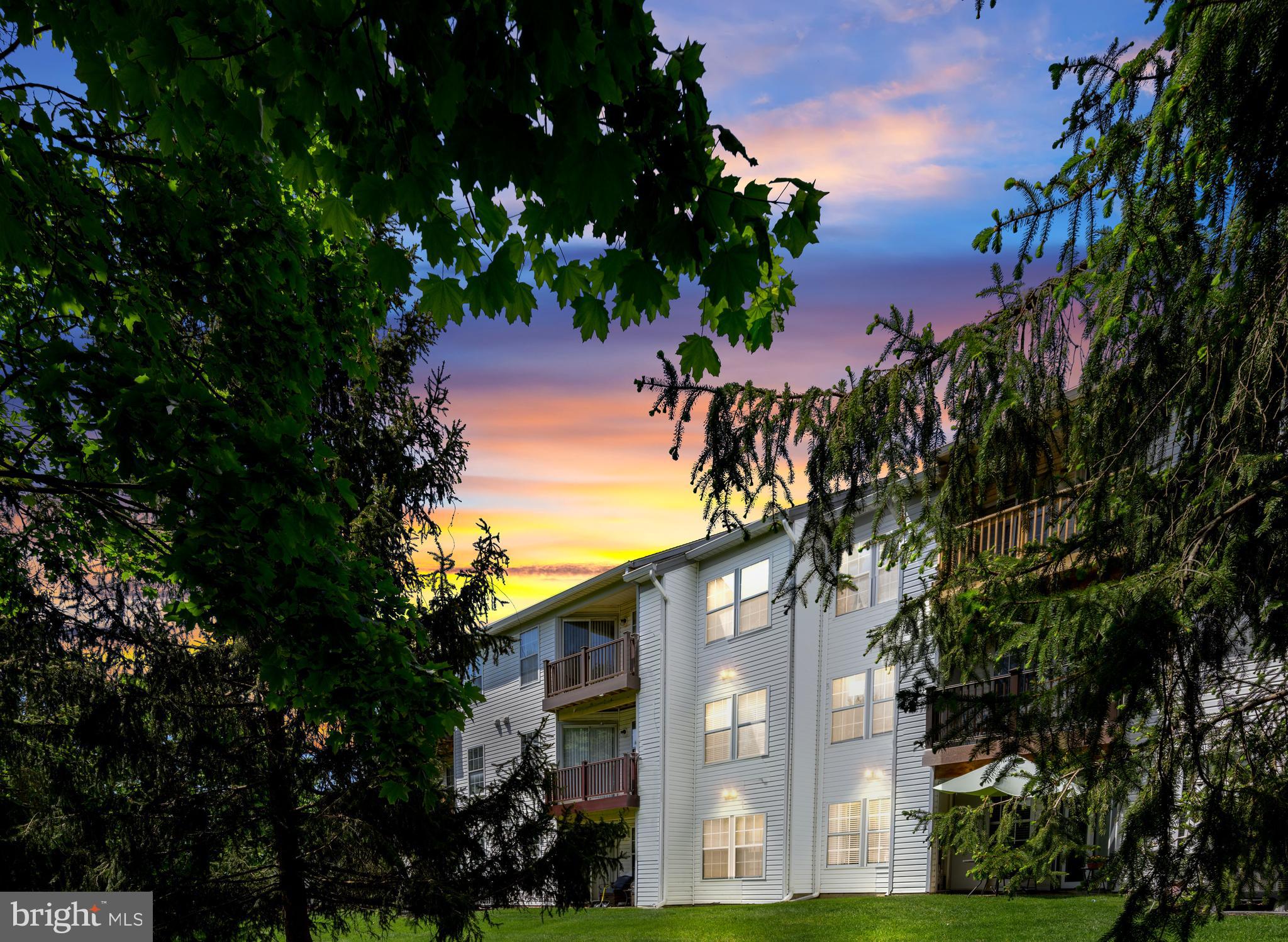 31 Beagle Run, Unit 88 Nottingham, MD 21236 - Photo 35 of 43 a view of a house with a tree in the background