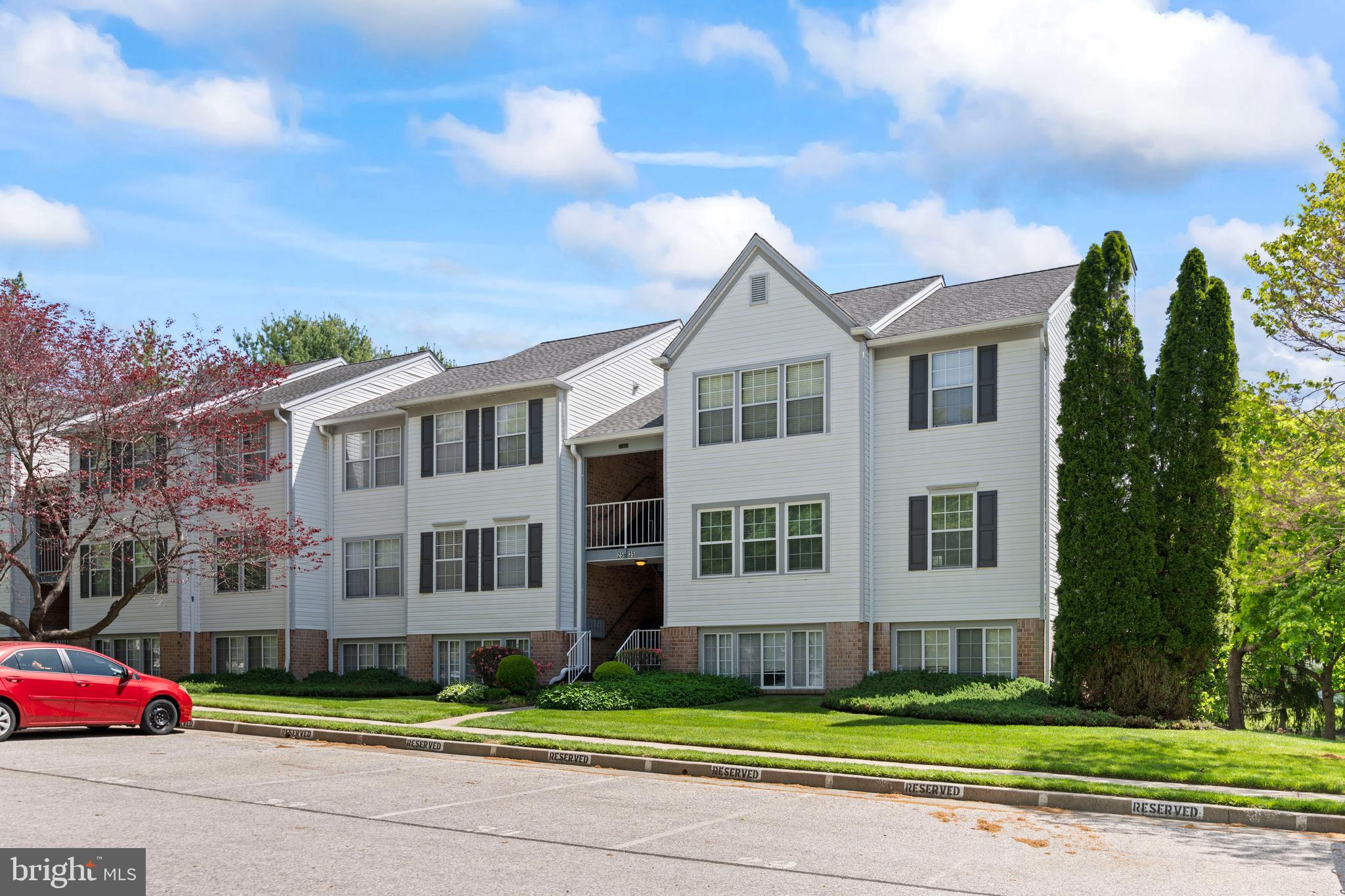 31 Beagle Run, Unit 88 Nottingham, MD 21236 - Photo 38 of 43 a view of a big yard in front of a brick house
