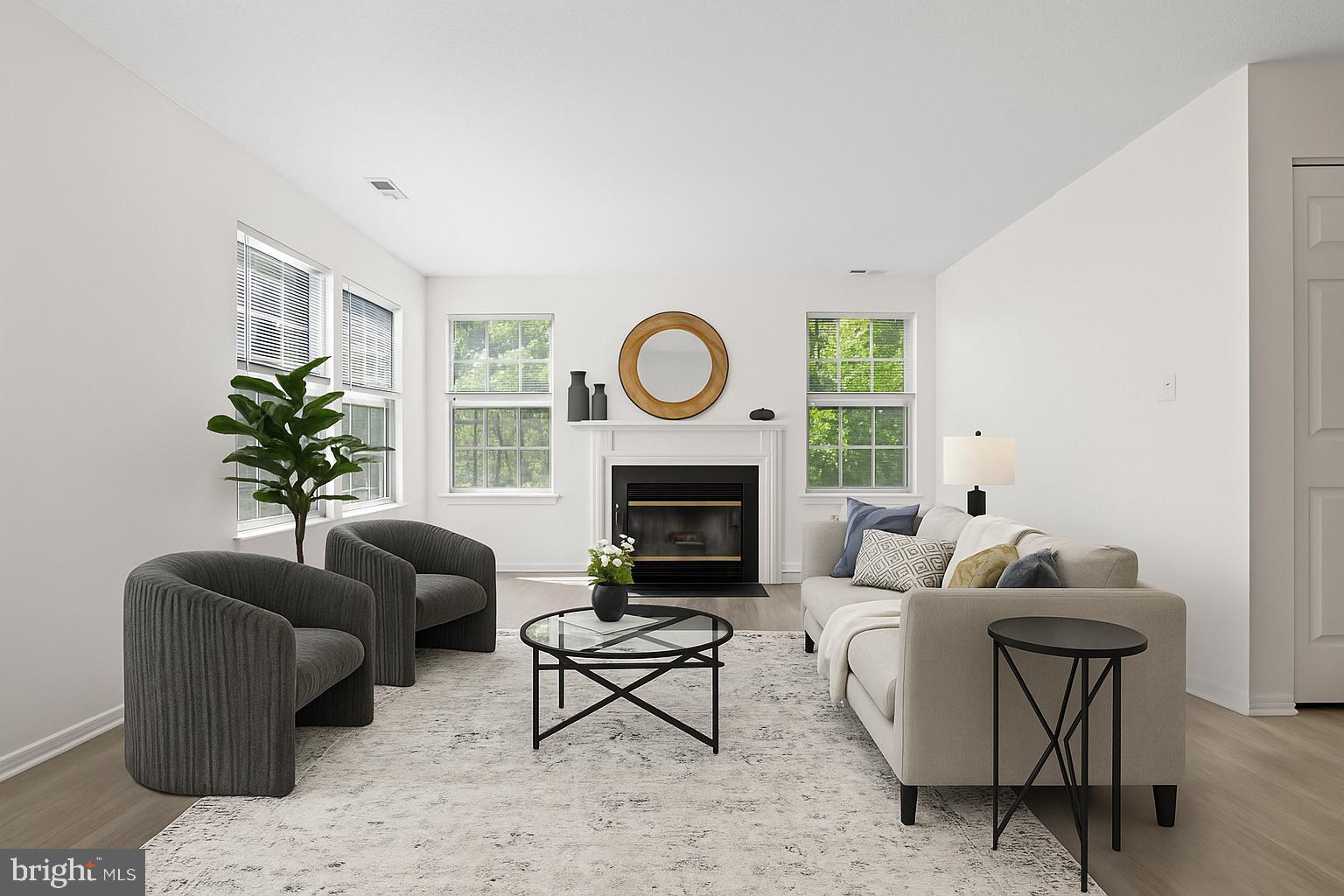 31 Beagle Run, Unit 88 Nottingham, MD 21236 - Photo 7 of 43 a living room with furniture a fireplace and a potted plant