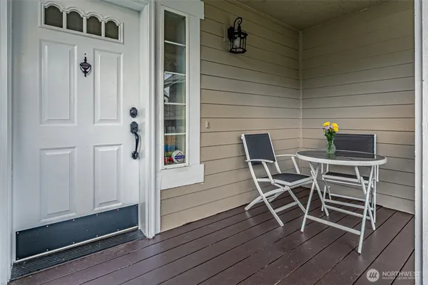 a patio with table and chairs