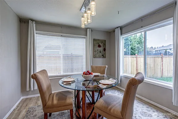 a view of a dining room with furniture window and outside view