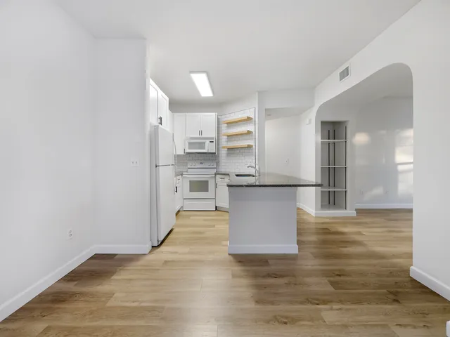 a view of kitchen with wooden floor