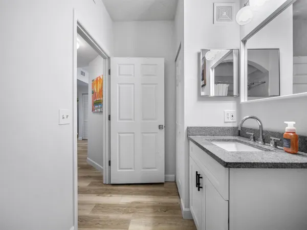 a bathroom with a sink and a mirror