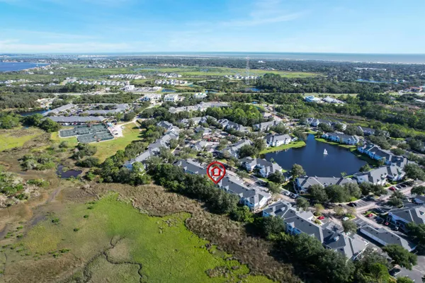 an aerial view of residential houses with city view