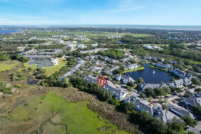 an aerial view of residential houses with city view