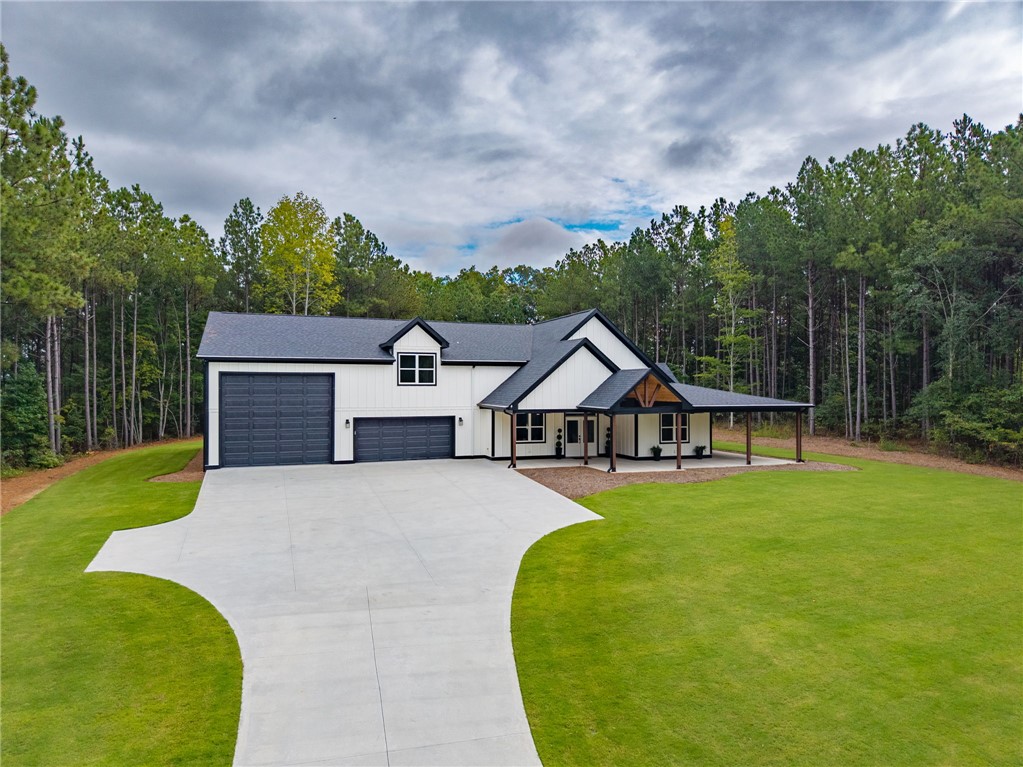 147 McAlister Road West Union, SC 29696 - Photo 2 of 50 Crisp modern farmhouse architecture defines this handsome home surrounded by mature trees.