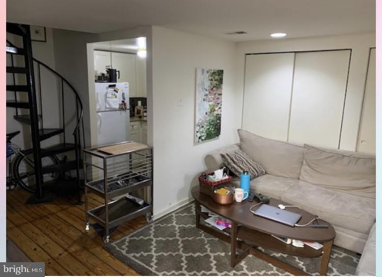 409 South 11th Street, Unit 1R Philadelphia, PA 19147 - Photo 3 of 12 a living room with furniture a rug and wooden floor