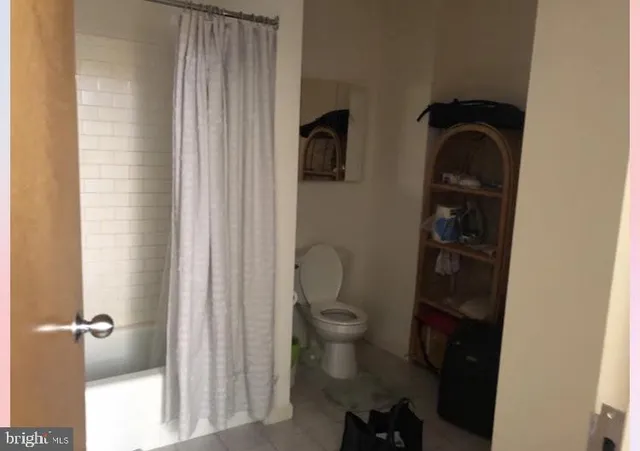 a bathroom with a toilet and a vanity