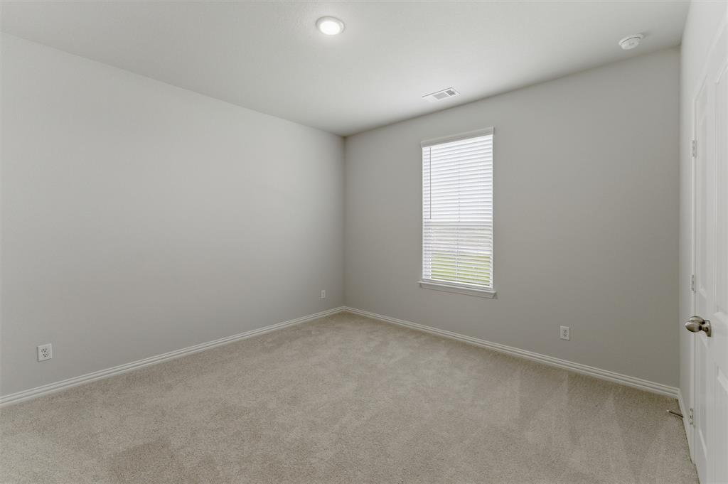2627 Witness Tree Road Terrell, TX 75161 - Photo 19 of 27 an empty room with a window