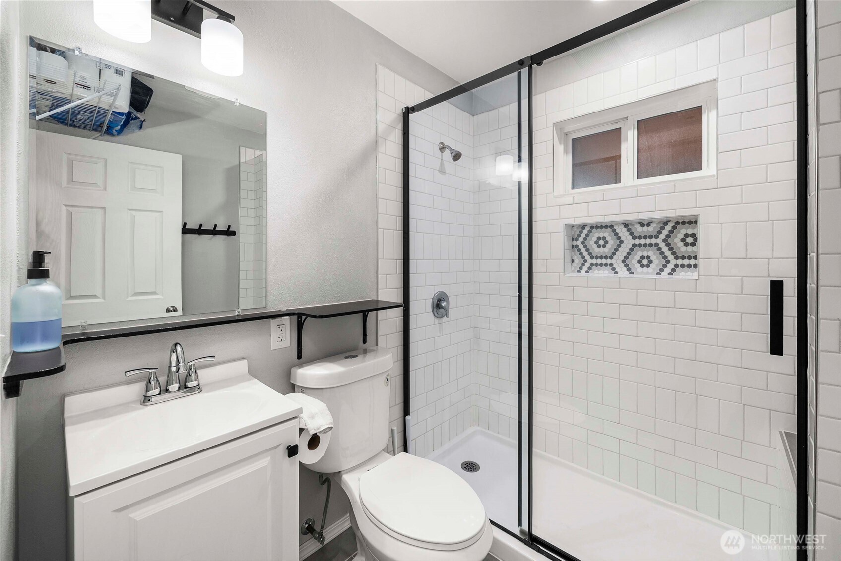 3608 South L Street Tacoma, WA 98418 - Photo 17 of 40 a bathroom with a sink a toilet and shower