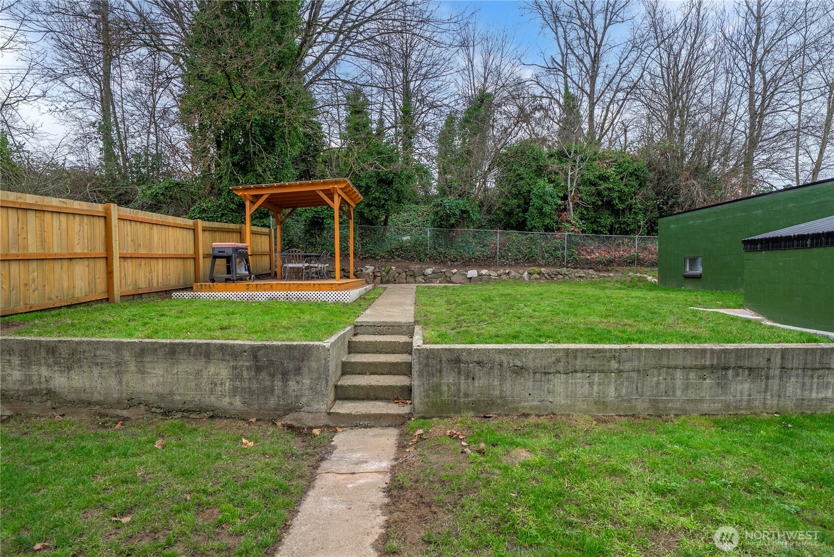 3608 South L Street Tacoma, WA 98418 - Photo 34 of 40 a view of a backyard with a small cabin