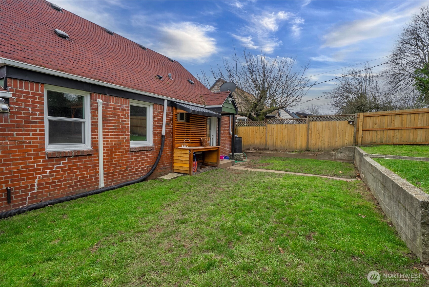 3608 South L Street Tacoma, WA 98418 - Photo 36 of 40 a view of a house with backyard and a tree