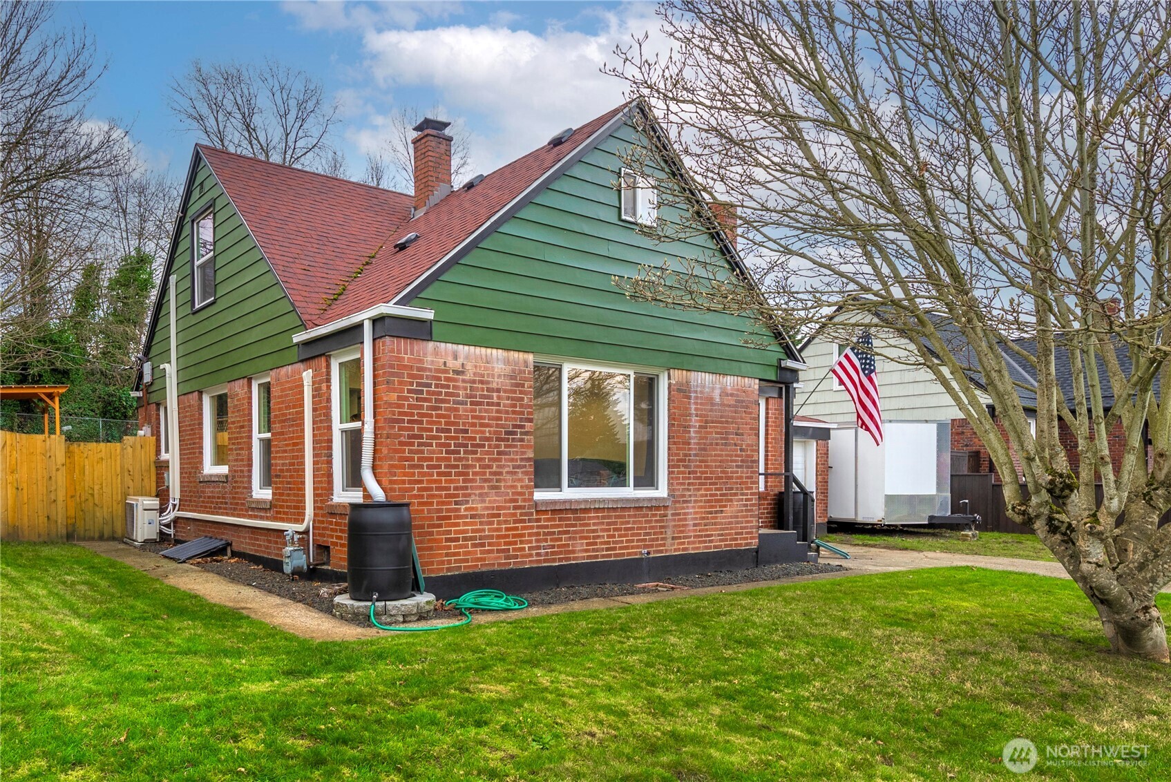 3608 South L Street Tacoma, WA 98418 - Photo 39 of 40 a front view of house with a garden