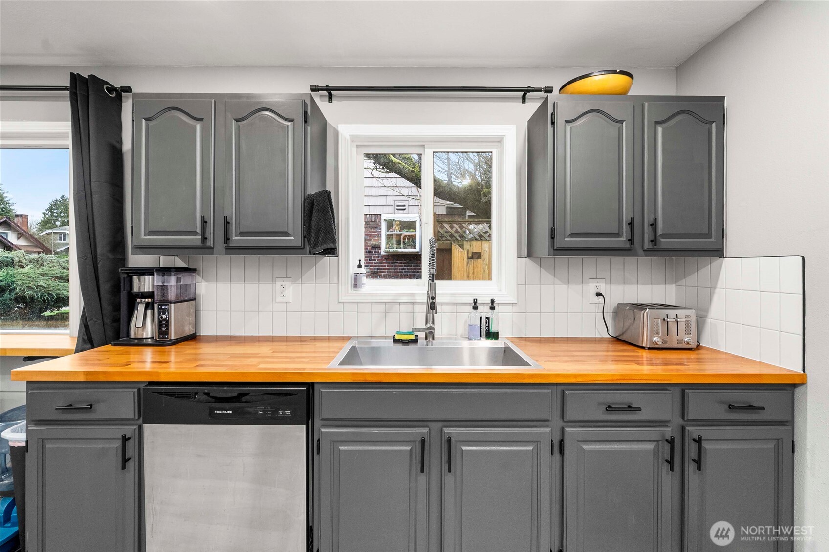3608 South L Street Tacoma, WA 98418 - Photo 7 of 40 a kitchen with a sink and a microwave