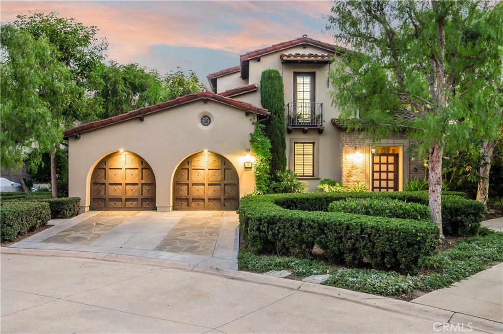 6 Pacific Winds Newport Coast, CA 92657 - Photo 1 of 10 a view of a house with large windows and a small yard