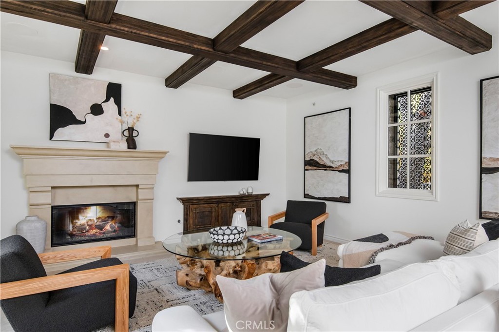6 Pacific Winds Newport Coast, CA 92657 - Photo 2 of 10 a living room with furniture and a fireplace