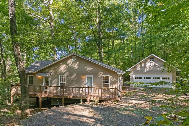 a view of a chairs and table on the balcony