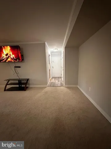 a view of a room with a flat screen tv