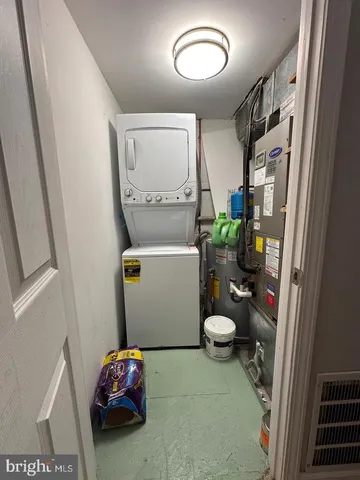 a bathroom with a toilet and a mirror