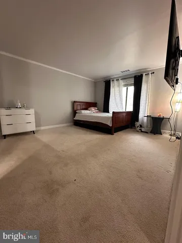 a room with furniture and a flat screen tv