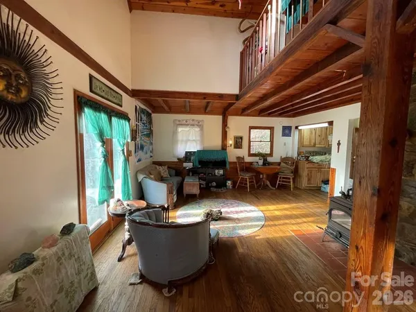 a living room with furniture window and wooden floor