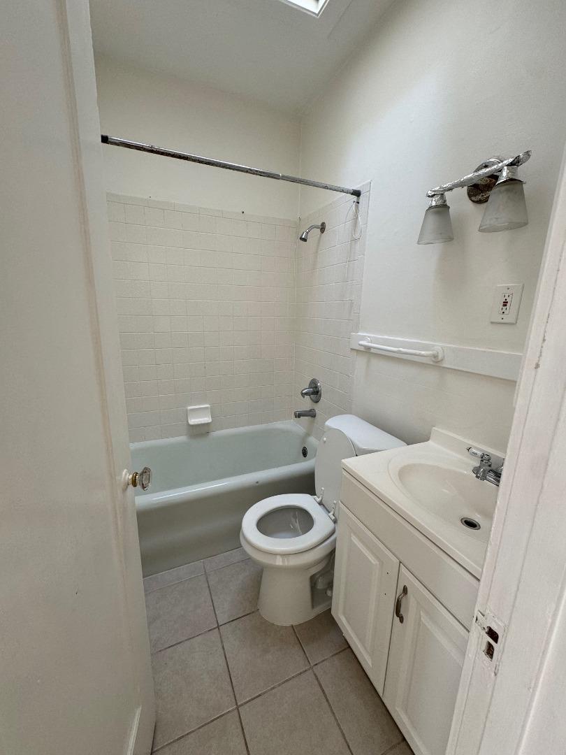 268 Lorton Avenue, Unit 2 Burlingame, CA 94010 - Photo 2 of 4 a bathroom with a sink a toilet and shower