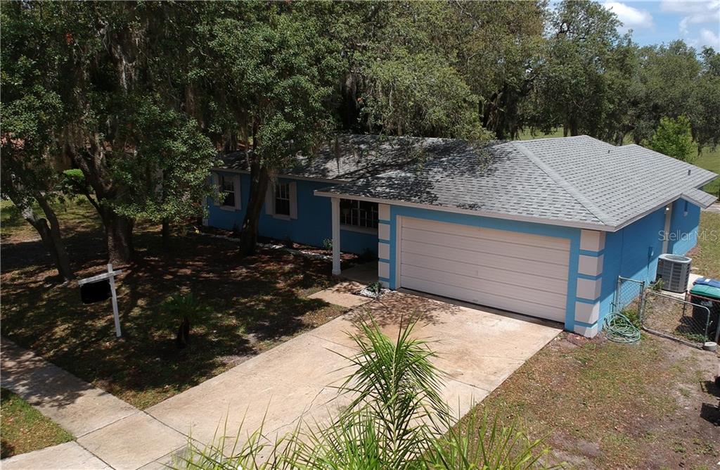 10377 Arbor Ridge Trail Orlando, FL 32817 - Photo 1 of 1 a view of a house with backyard and sitting area