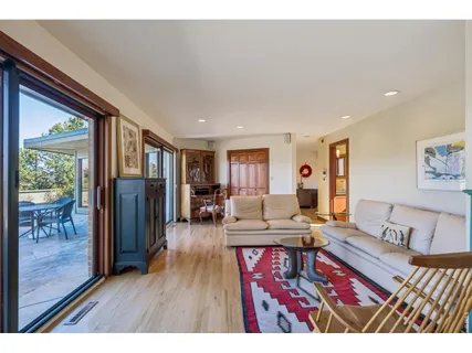 a living room with furniture and a table