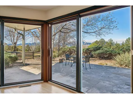 a view of a room with a large window