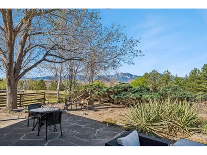 a view of outdoor space with a table and chairs