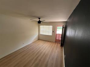 906 East 46th Street, Unit C Austin, TX 78751 - Photo 4 of 12 wooden floor in an empty room with a window