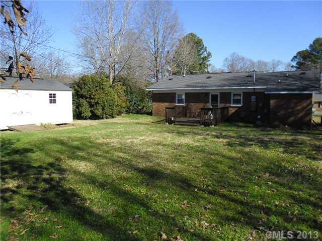 207 Williams Road Wingate, NC 28174 - Photo 14 of 15 a view of a house with a yard and sitting area