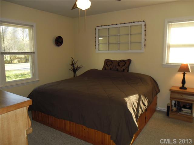 207 Williams Road Wingate, NC 28174 - Photo 8 of 15 a bedroom with a bed and a window