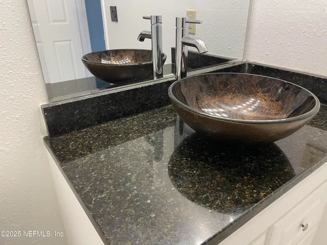 a kitchen with a sink and a stove