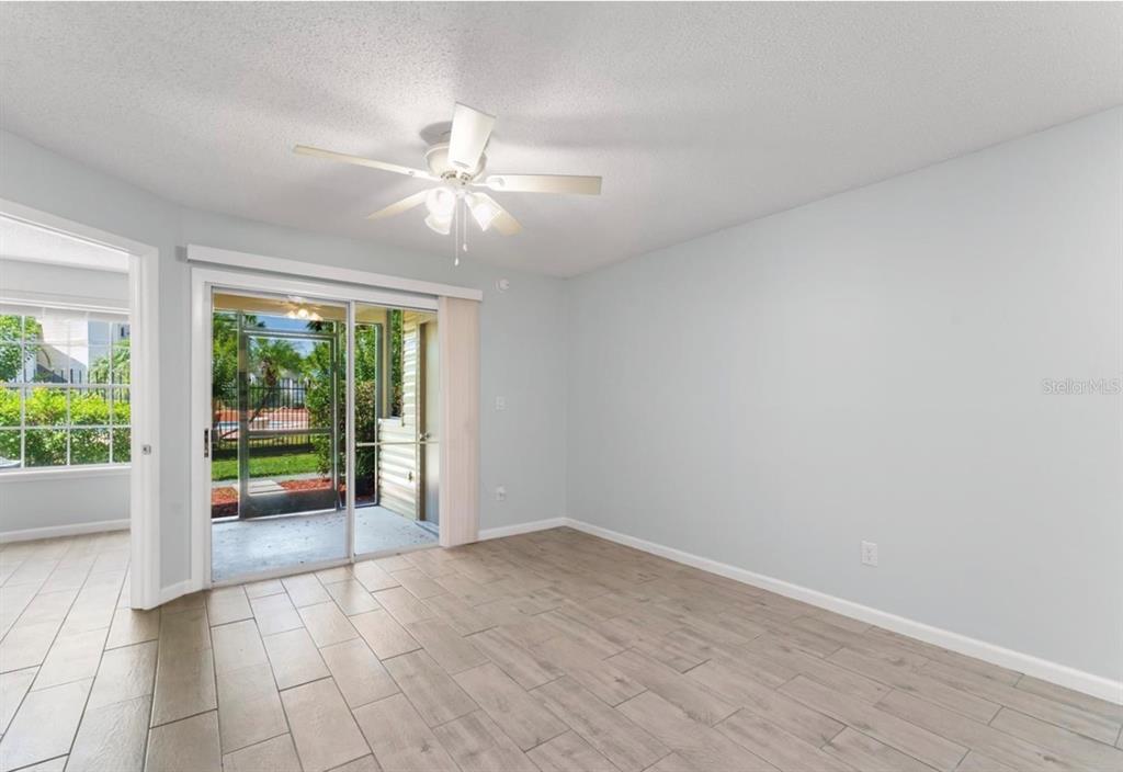 1908 Lake Atriums Circle, Unit 3 Orlando, FL 32839 - Photo 11 of 17 wooden floor in an empty room with a window