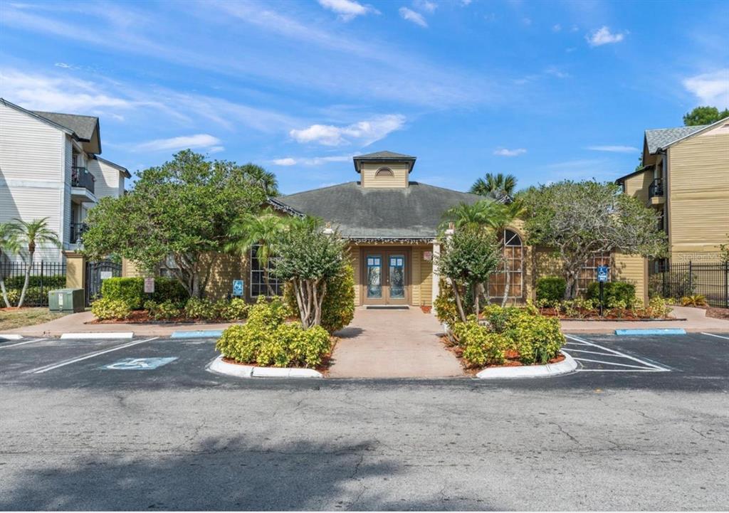 1908 Lake Atriums Circle, Unit 3 Orlando, FL 32839 - Photo 16 of 17 a front view of a house with a yard