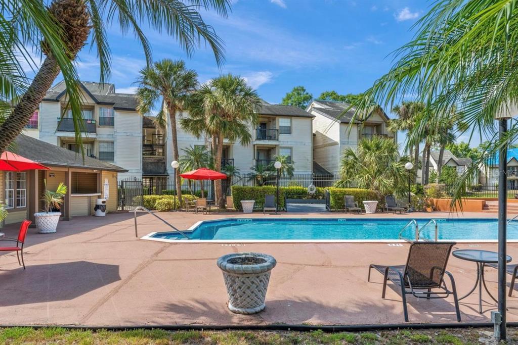 1908 Lake Atriums Circle, Unit 3 Orlando, FL 32839 - Photo 17 of 17 a view of swimming pool with outdoor seating