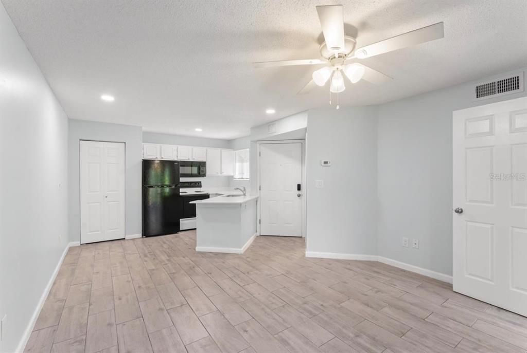 1908 Lake Atriums Circle, Unit 3 Orlando, FL 32839 - Photo 5 of 17 a view of a kitchen with wooden floor
