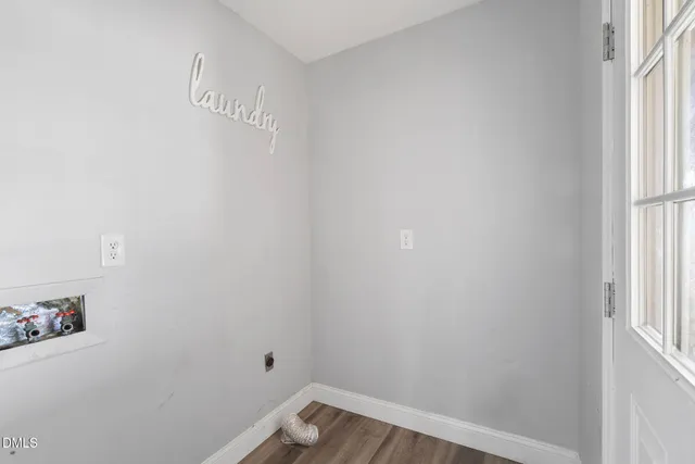 a bathroom with a granite countertop toilet sink and mirror