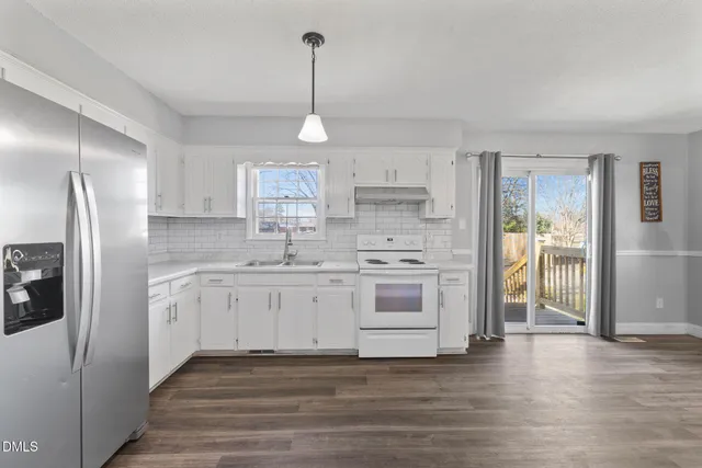 wooden floor in an empty room with a fireplace