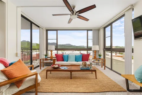 a living room with furniture and a large window