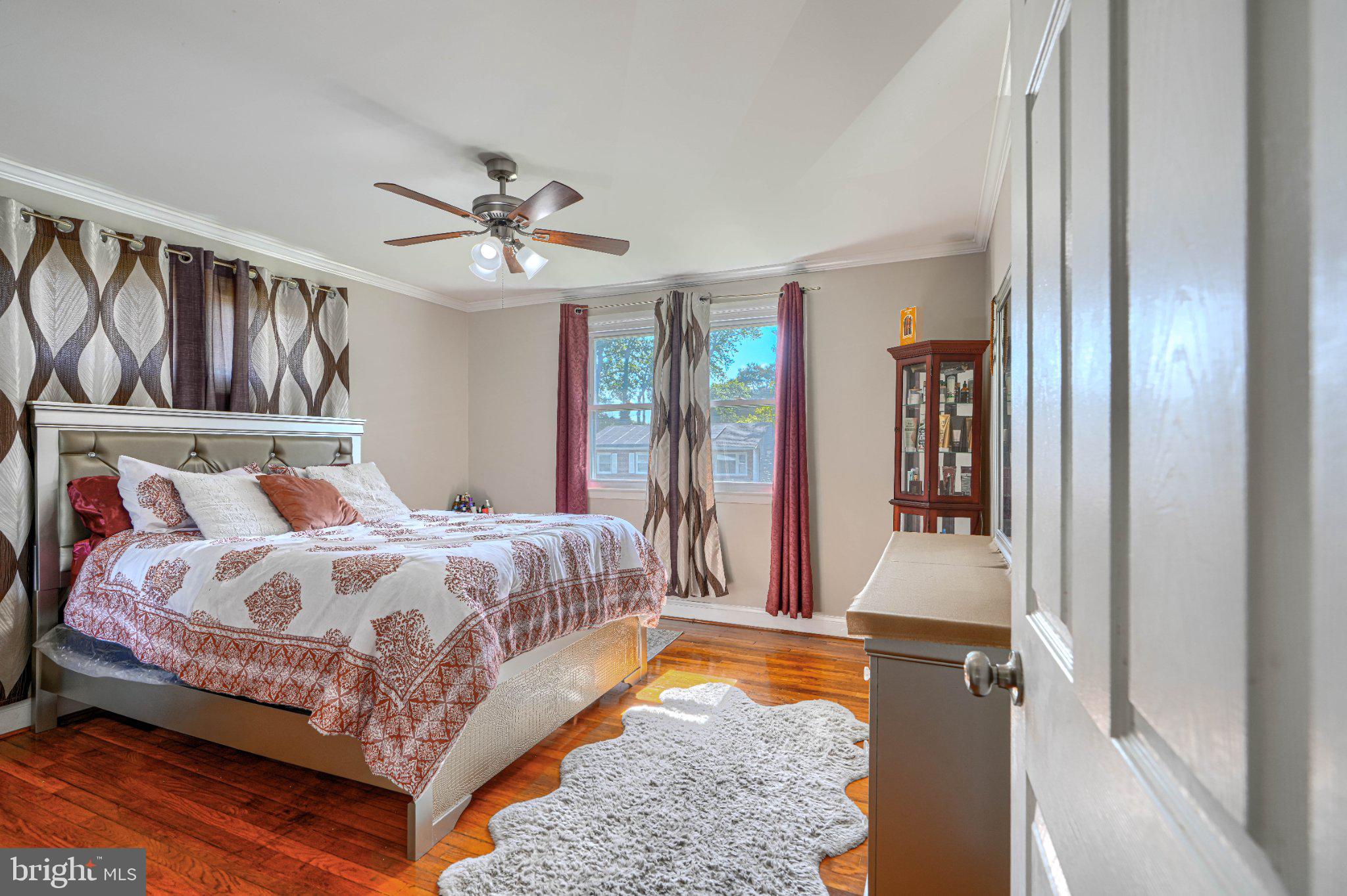 3708 Cassen Road Randallstown, MD 21133 - Photo 17 of 38 a bed sitting in a bedroom next to a window