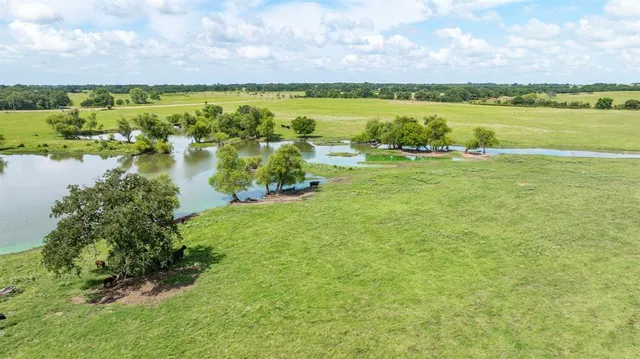 a view of a lake with houses in the back