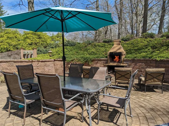 a view of an outdoor sitting area with furniture and backyard