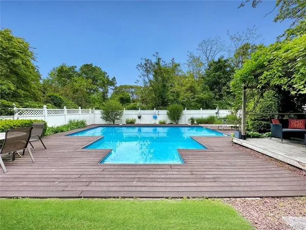 a view of a backyard with sitting area