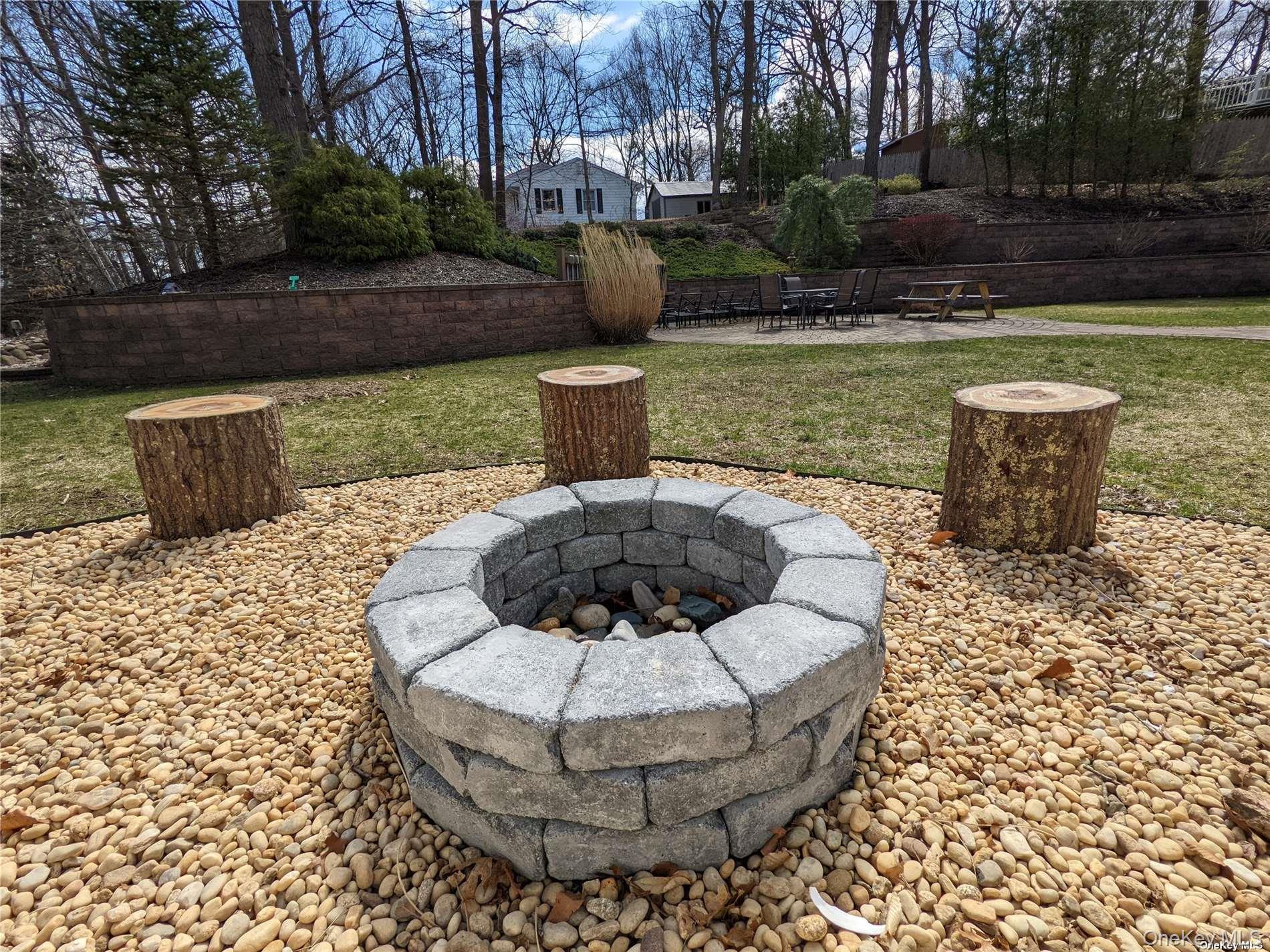 126 Overhill Road Wading River, NY 11792 - Photo 19 of 23 a view of a fountain in the patio with a fountain