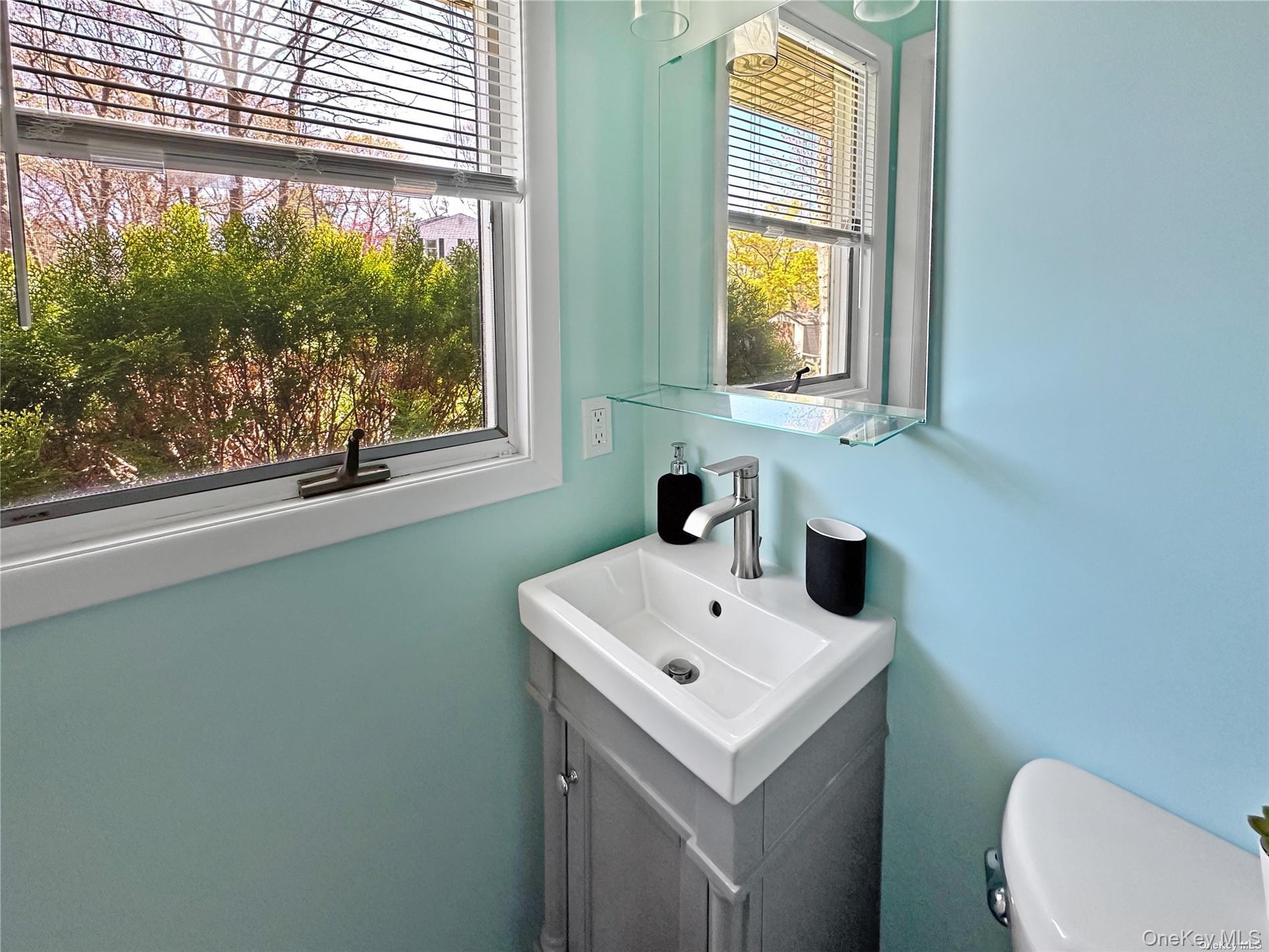 126 Overhill Road Wading River, NY 11792 - Photo 6 of 23 a bathroom with a sink and a toilet