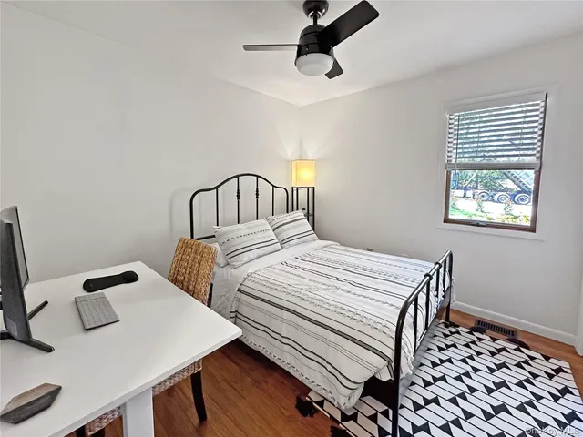 a bedroom with a bed and a table in it